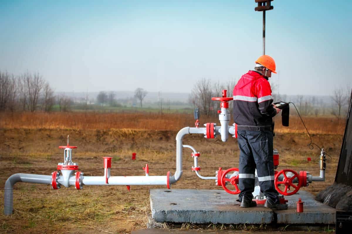 Texas oil field worker checking for h2s leak