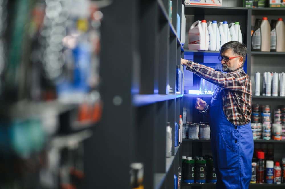 retail employee stocking shelves after returning to work after injury